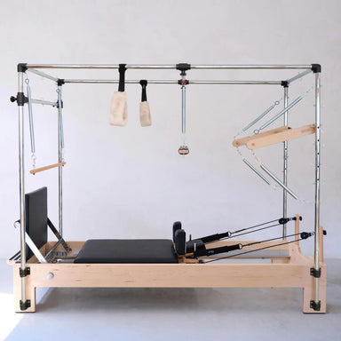 Wooden Pilates full-body training machine with tower and sliding platform for versatile exercises