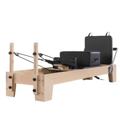 Origin Fitness Maple Wood Pilates Reformer with maple frame and black padded carriage for home Pilates workouts