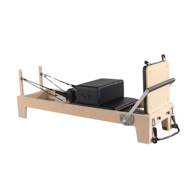 Origin Fitness Maple Wood Pilates Reformer with padded grey carriage and adjustable resistance springs