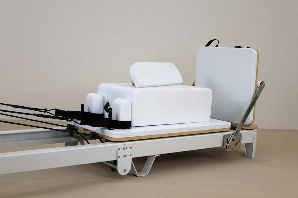 white reformer machine for studio, white leather workout equipment