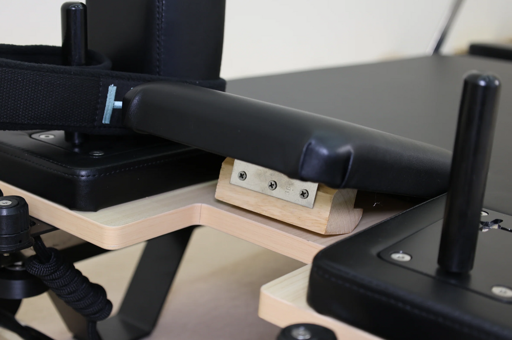Folding wood pilates machine for homes with black leather 