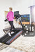 home treadmill fold up workout machine no clutter HIIT equipment for yoga studio