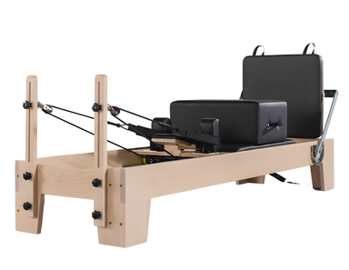 Origin Fitness Maple Wood Pilates Reformer with maple frame and black padded carriage for home Pilates workouts