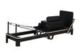 Origin Aluminium Folding Pilates Reformer with padded carriage and adjustable resistance in black and white
