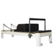 white wood pilates reformer with blak leather home use